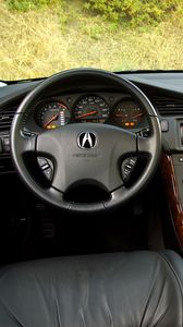 Превью обои acura, tl, 2002, салон, интерьер, руль, спидометр, трава