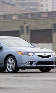 Превью обои acura, tsx, 2010, голубой, вид сбоку, стиль, авто, акура, здание, скорость, асфальт