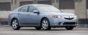 Превью обои acura, tsx, 2010, голубой, вид сбоку, стиль, авто, акура, здание, скорость, асфальт