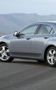 Превью обои acura, tsx, 2010, серый металлиик, вид сбоку, стиль, авто, акура, горы, асфальт, туман