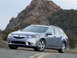 Превью обои acura, tsx, 2010, голубой, вид спереди, стиль, авто, акура, кустарники, скала, небо, асфальт