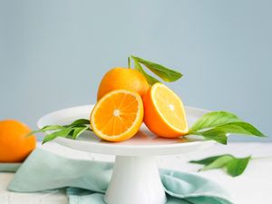 Превью обои апельсины, дольки, листья, фрукт, цитрус
