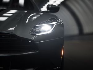 Превью обои aston martin db11, aston martin, спорткар, серый, фара, вид спереди, крупный план