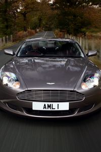 Превью обои aston martin, db9, 2004, серый, вид спереди, стиль, астон мартин, авто, скорость, природа, деревья, трава