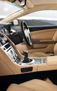 Превью обои aston martin, db9, 2006, бежевый, интерьер, салон, руль, спидометр