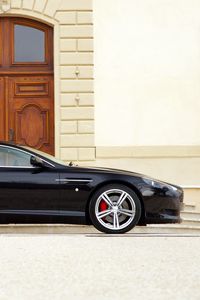 Превью обои aston martin, db9, 2006, черный, вид сбоку, спорт, стиль, астон мартин, авто, здание