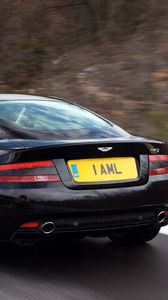 Превью обои aston martin, db9, 2006, черный, вид сзади, стиль, авто, скорость, природа, деревья