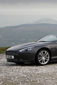 Превью обои aston martin, db9, 2010, черный, вид сбоку, стиль, авто, астон мартин, спорт, природа, горы