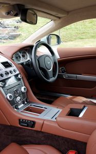 Превью обои aston martin, db9, 2010, коричневый, салон, интерьер, руль, спидометр, кожа