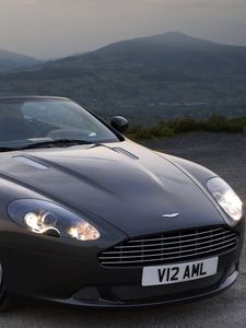 Превью обои aston martin, db9, 2010, черный, вид спереди, стиль, авто, астон мартин, горы