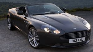 Превью обои aston martin, db9, 2010, черный, вид спереди, стиль, авто, астон мартин, горы