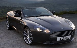 Превью обои aston martin, db9, 2010, черный, вид спереди, стиль, авто, астон мартин, горы