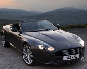 Превью обои aston martin, db9, 2010, черный, вид спереди, стиль, авто, астон мартин, горы