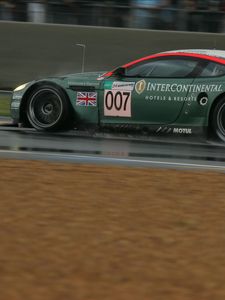 Превью обои aston martin, dbr9, 2005, зеленый, вид сбоку, стиль, спорт, астон мартин, авто, скорость, мокрый асфальт