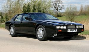 Превью обои aston martin lagonda, 1987, черный, вид сбоку, астон мартин, природа, асфальт