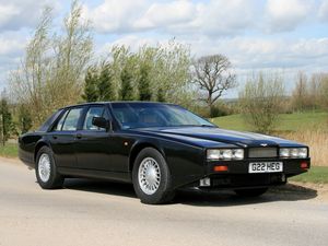 Превью обои aston martin lagonda, 1987, черный, вид сбоку, астон мартин, природа, асфальт