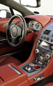 Превью обои aston martin, rapide, 2009, красный, салон, интерьер, руль, спидометр