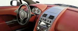 Превью обои aston martin, rapide, 2009, красный, салон, интерьер, руль, спидометр