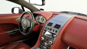 Превью обои aston martin, rapide, 2009, красный, салон, интерьер, руль, спидометр