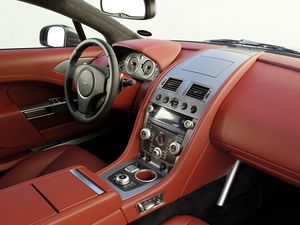 Превью обои aston martin, rapide, 2009, красный, салон, интерьер, руль, спидометр