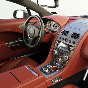 Превью обои aston martin, rapide, 2009, красный, салон, интерьер, руль, спидометр