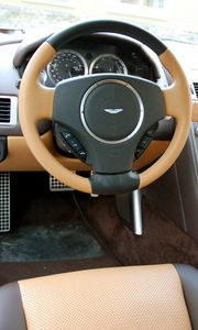 Превью обои aston martin, rapide, 2011, коричневый, салон, интерьер, руль, спидометр