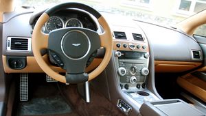 Превью обои aston martin, rapide, 2011, коричневый, салон, интерьер, руль, спидометр