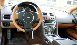 Превью обои aston martin, rapide, 2011, коричневый, салон, интерьер, руль, спидометр