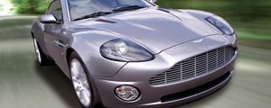 Превью обои aston martin, v12, vanquish, 2001, сиреневый, вид спереди, авто, астон мартин, скорость