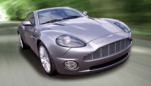 Превью обои aston martin, v12, vanquish, 2001, сиреневый, вид спереди, авто, астон мартин, скорость