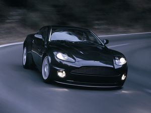 Превью обои aston martin, v12, vanquish, 2004, черный, вид спереди, астон мартин, асфальт