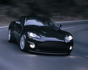 Превью обои aston martin, v12, vanquish, 2004, черный, вид спереди, астон мартин, асфальт