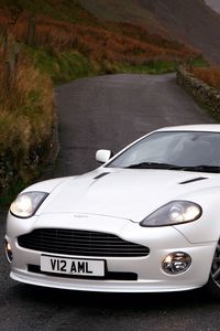 Превью обои aston martin, v12, vanquish, 2004, белый, вид спереди, стиль, астон мартин, природа