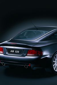 Превью обои aston martin, v12, vanquish, 2004, черный, вид сбоку, стиль, астон мартин