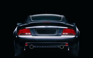 Превью обои aston martin, v12, vanquish, 2004, черный, вид сзади, стиль, астон мартин