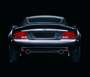 Превью обои aston martin, v12, vanquish, 2004, черный, вид сзади, стиль, астон мартин