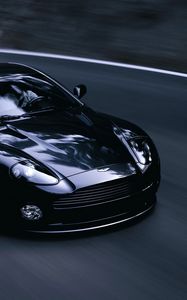 Превью обои aston martin, v12, vanquish, 2004, черный, вид спереди, стиль, астон мартин, асфальт