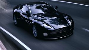 Превью обои aston martin, v12, vanquish, 2004, черный, вид спереди, стиль, астон мартин, асфальт