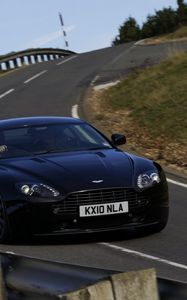 Превью обои aston martin, v8, 2010, черный, вид спереди, стиль, астон мартин, трасса