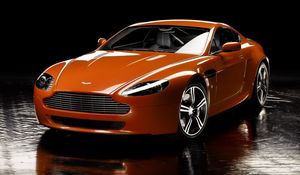 Превью обои aston martin, v8, vantage, 2008, оранжевый, вид спереди, отражение