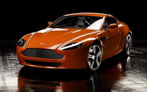 Превью обои aston martin, v8, vantage, 2008, оранжевый, вид спереди, отражение