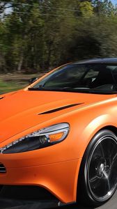 Превью обои aston martin, vanquish orange, оранжевый, скорость, вид спереди