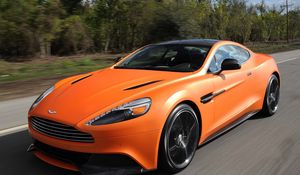 Превью обои aston martin, vanquish orange, оранжевый, скорость, вид спереди