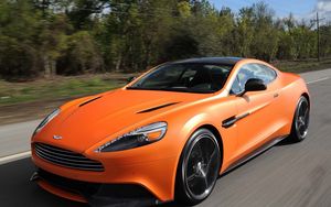 Превью обои aston martin, vanquish orange, оранжевый, скорость, вид спереди