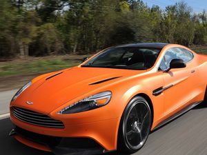 Превью обои aston martin, vanquish orange, оранжевый, скорость, вид спереди