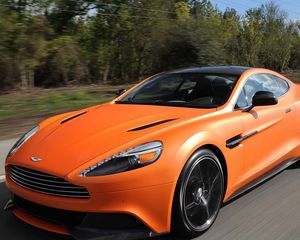 Превью обои aston martin, vanquish orange, оранжевый, скорость, вид спереди