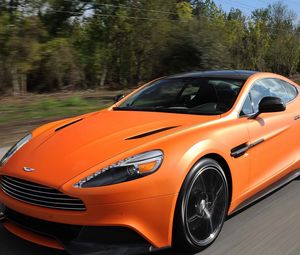 Превью обои aston martin, vanquish orange, оранжевый, скорость, вид спереди