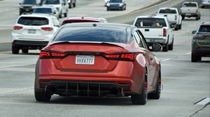 Превью обои автомобиль, красный, шипы, дорога