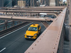 Превью обои автомобиль, желтый, мост, город, здания