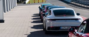 Превью обои автомобили, разноцветный, стоянка, трасса